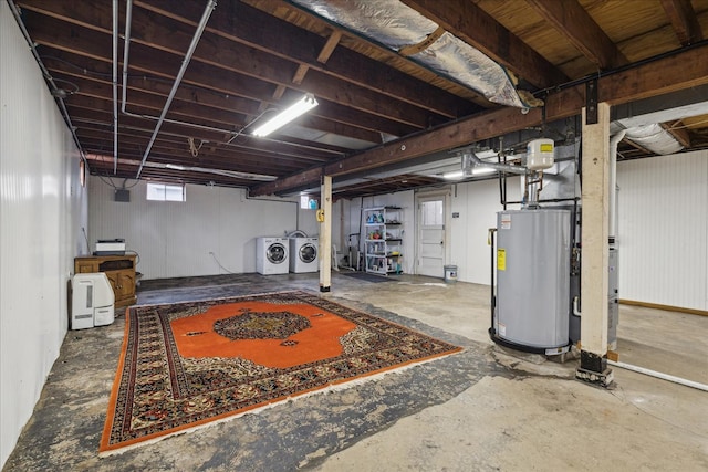 basement with washing machine and clothes dryer and water heater