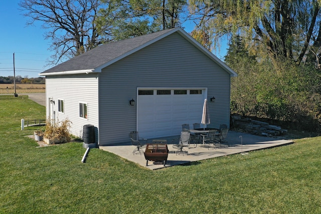 garage featuring a lawn