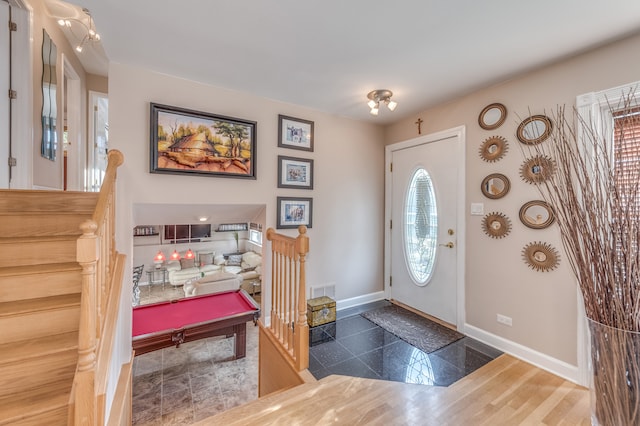 entrance foyer featuring dark wood-type flooring and pool table