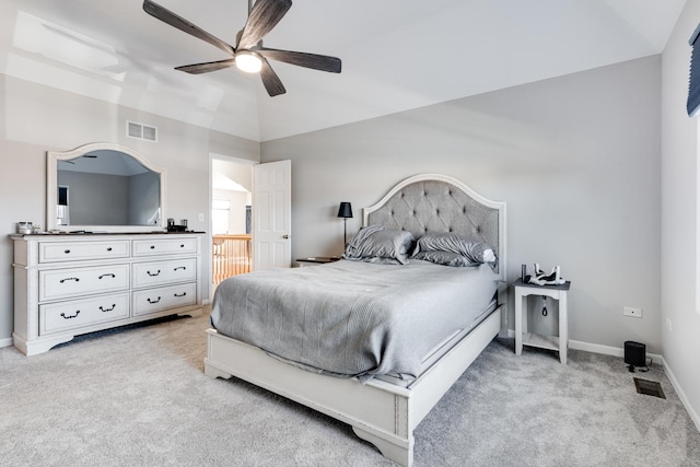 bedroom with ceiling fan, light carpet, and lofted ceiling