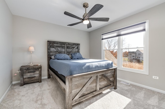 bedroom featuring ceiling fan and light colored carpet