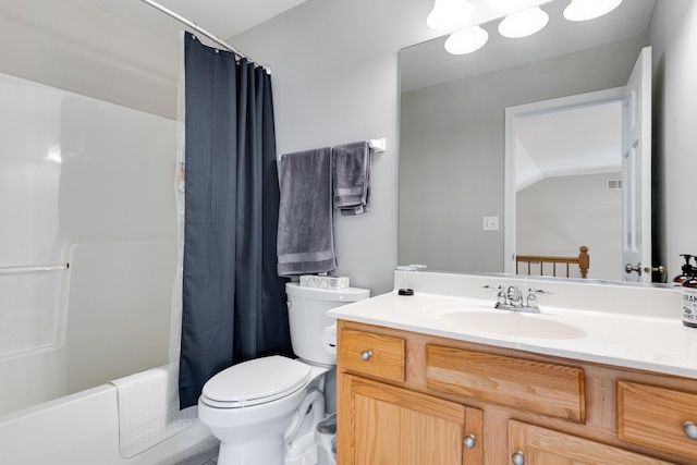 full bathroom with vanity, toilet, lofted ceiling, and shower / tub combo