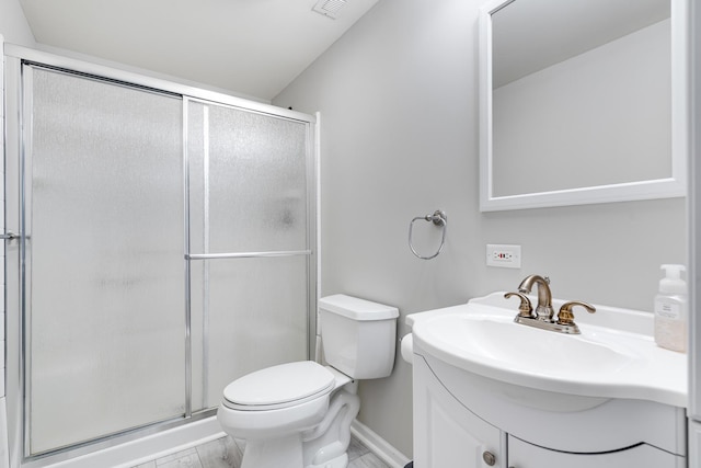 bathroom featuring walk in shower, vanity, and toilet