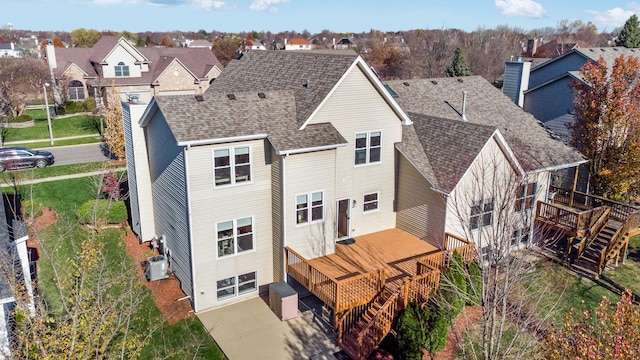 back of property featuring a deck