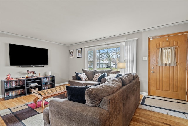 living room featuring crown molding and wood-type flooring