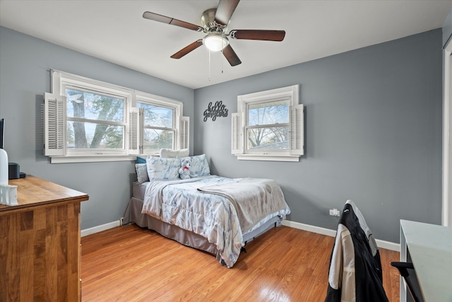 bedroom featuring light wood-type flooring and ceiling fan