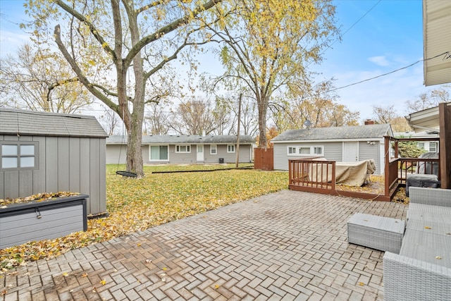 view of patio / terrace featuring a storage unit