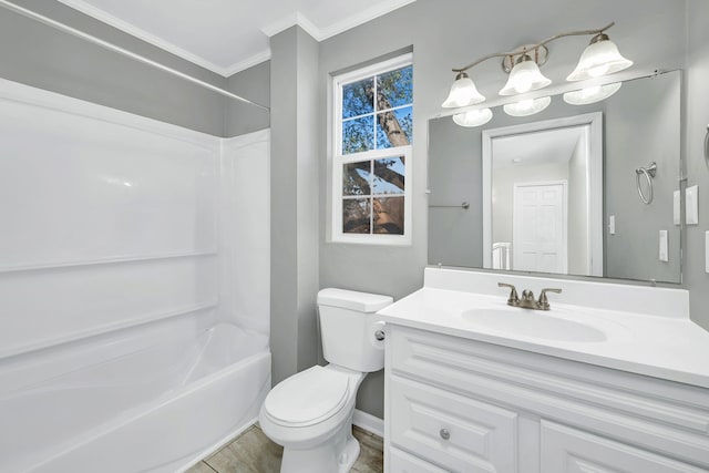 full bathroom featuring washtub / shower combination, vanity, toilet, and crown molding