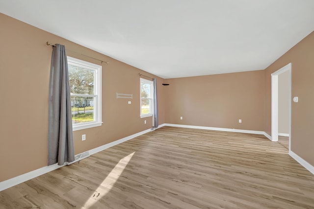 spare room with light hardwood / wood-style floors