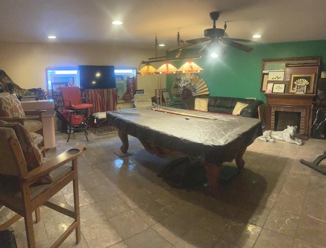 rec room with a fireplace and billiards