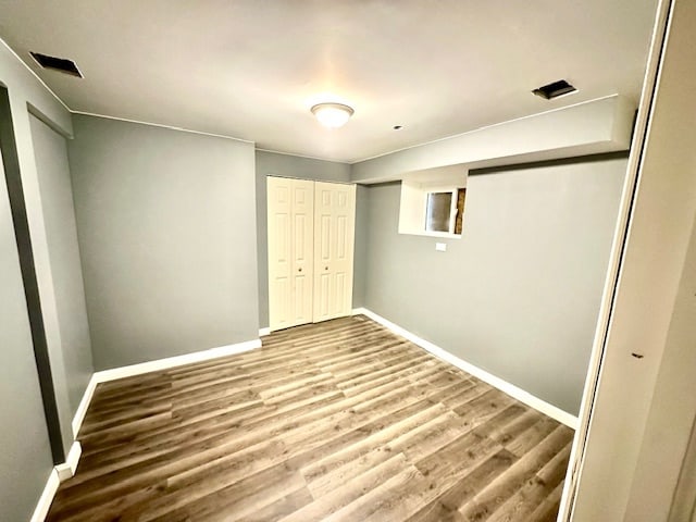 unfurnished bedroom featuring hardwood / wood-style flooring