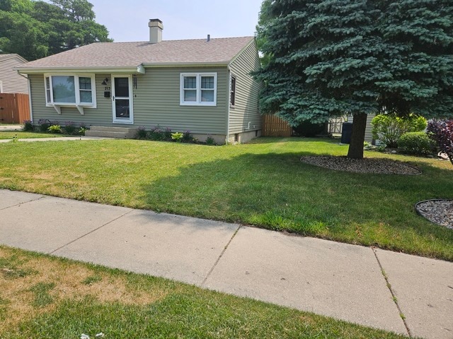 view of front of property with a front lawn