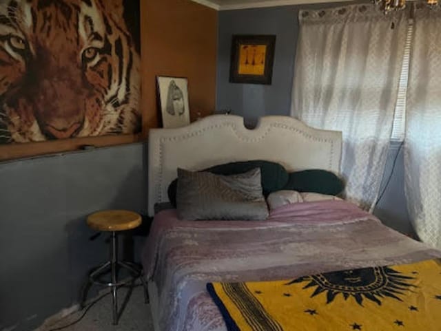 bedroom with crown molding