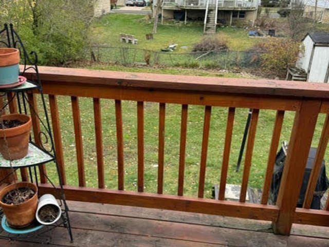 exterior space featuring a shed and a lawn