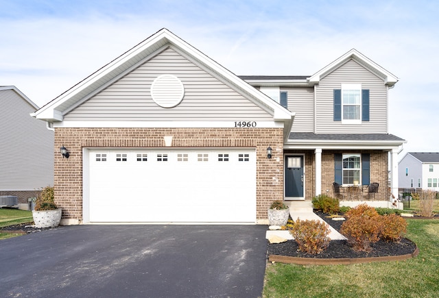 front of property with a garage