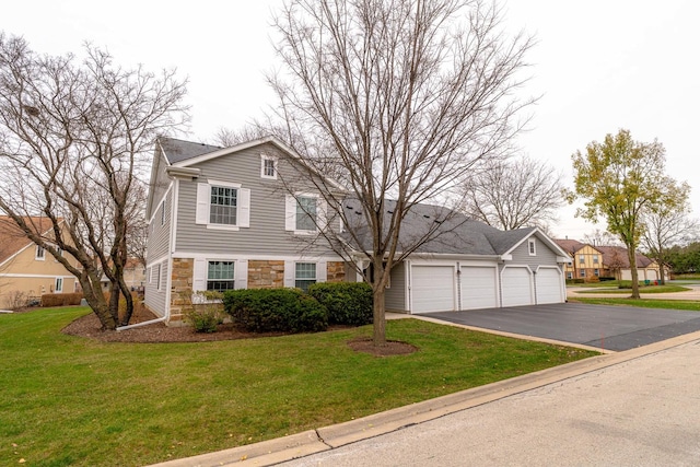 view of front of house featuring a garage and a front yard