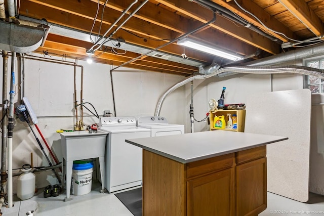 laundry room with cabinets and washer and dryer