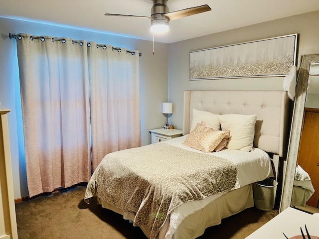 bedroom featuring dark carpet and ceiling fan