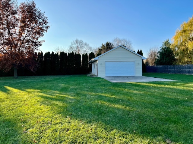 view of yard featuring an outbuilding and a garage