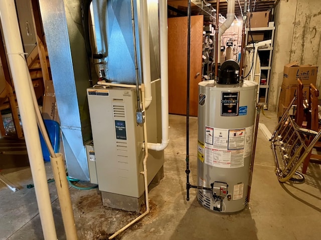 utility room featuring gas water heater