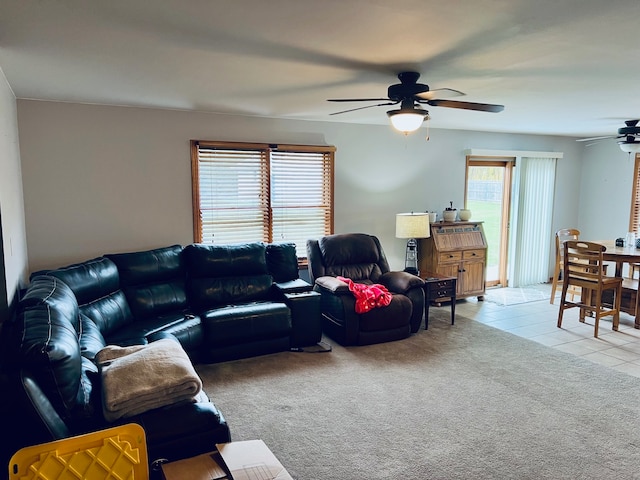 living room featuring ceiling fan and light tile patterned floors