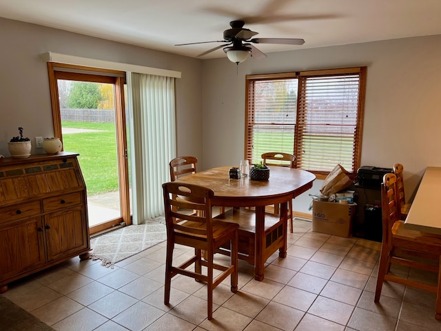 dining area featuring light tile patterned floors and ceiling fan