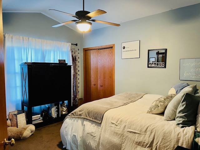 carpeted bedroom featuring ceiling fan and lofted ceiling