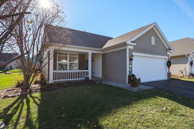 ranch-style home with a front yard, a garage, and covered porch