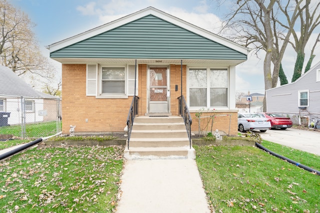 bungalow with a front yard