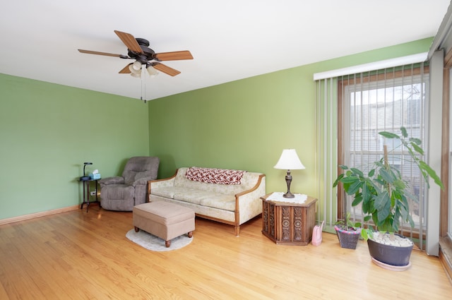 living room with hardwood / wood-style flooring and ceiling fan