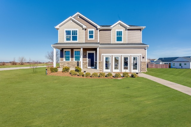 craftsman house featuring a front lawn