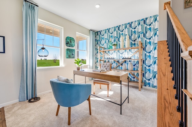 carpeted home office featuring baseboards