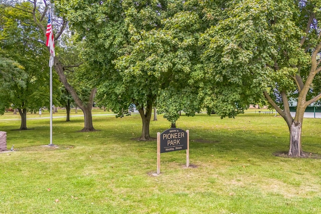 view of home's community with a yard