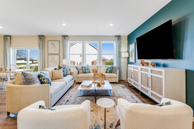 living room with recessed lighting and wood finished floors