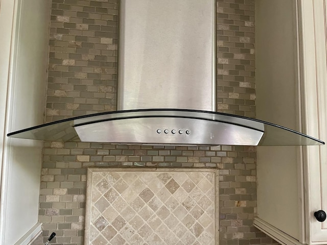 interior details with wall chimney range hood