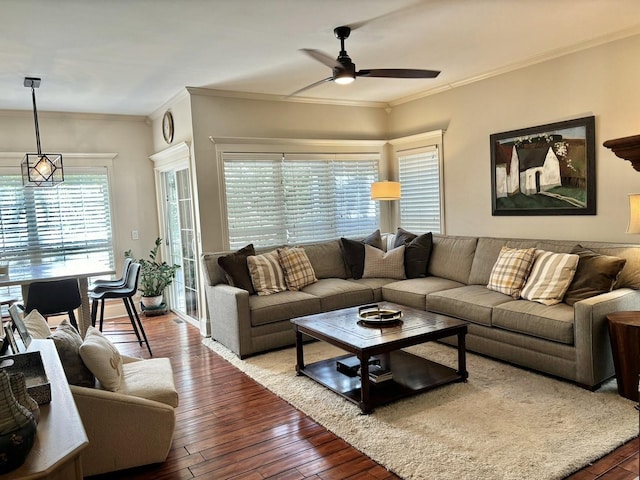 living room with ceiling fan, wood-type flooring, and ornamental molding