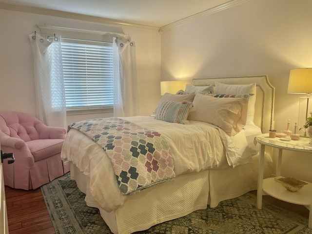 bedroom featuring wood-type flooring and crown molding