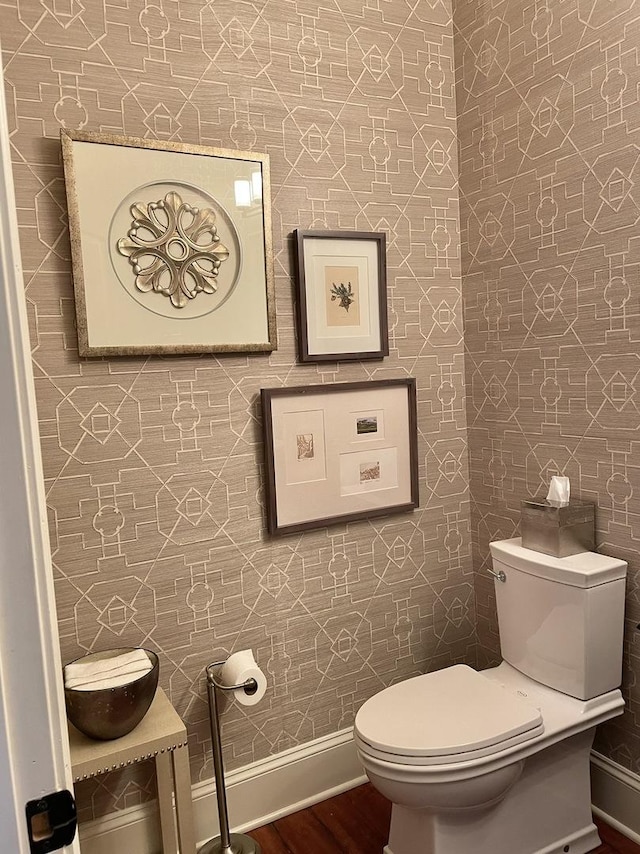 bathroom with wood-type flooring and toilet