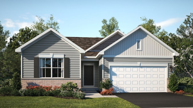 view of front of property with a garage and a front yard