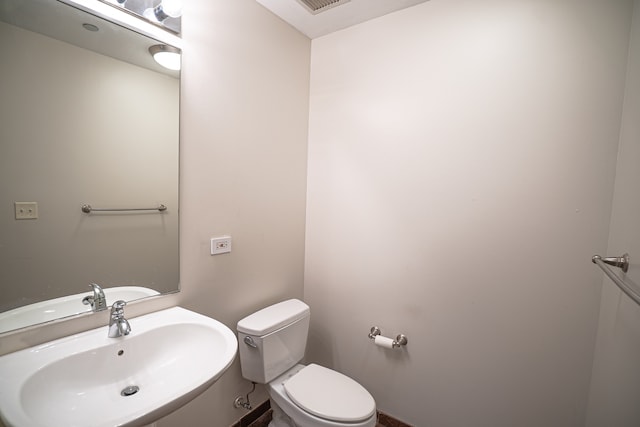 bathroom with sink and toilet