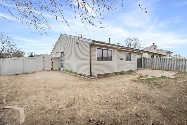 rear view of property with a patio area