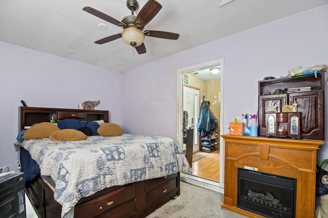 carpeted bedroom with ceiling fan