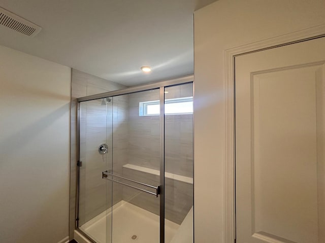 full bath with visible vents and a shower stall