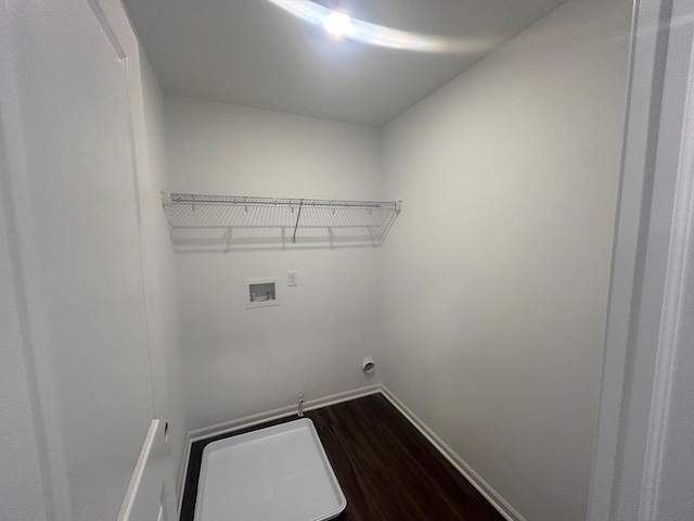 washroom with baseboards, laundry area, washer hookup, and dark wood-style floors