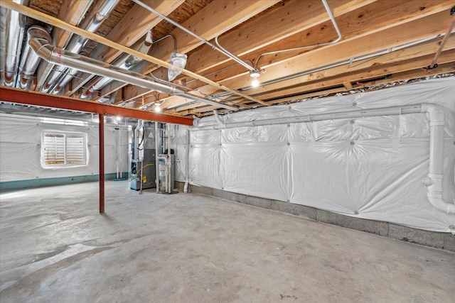 unfinished basement featuring water heater and heating unit