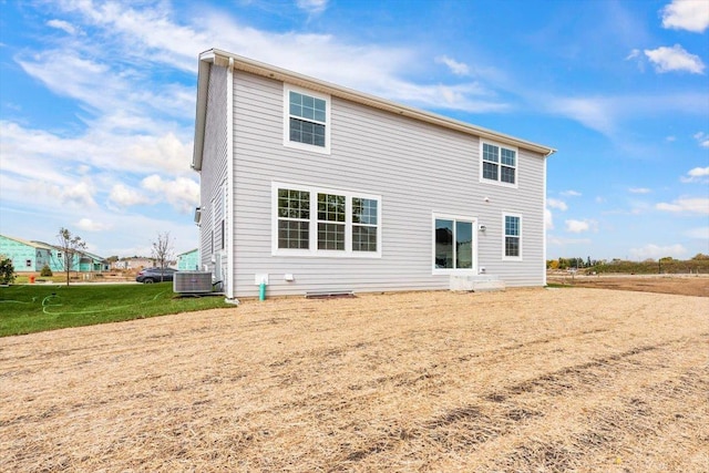 rear view of house featuring cooling unit