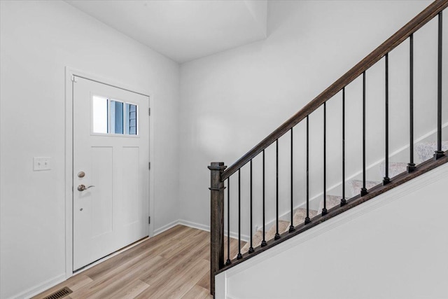 entrance foyer with light hardwood / wood-style flooring