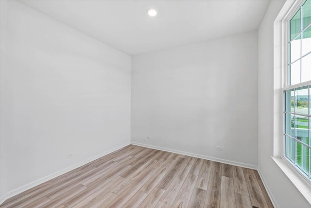 empty room with light hardwood / wood-style floors