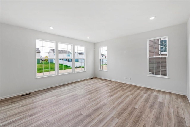 empty room with light wood-type flooring