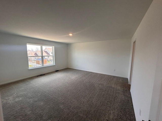 spare room featuring recessed lighting, baseboards, visible vents, and carpet floors